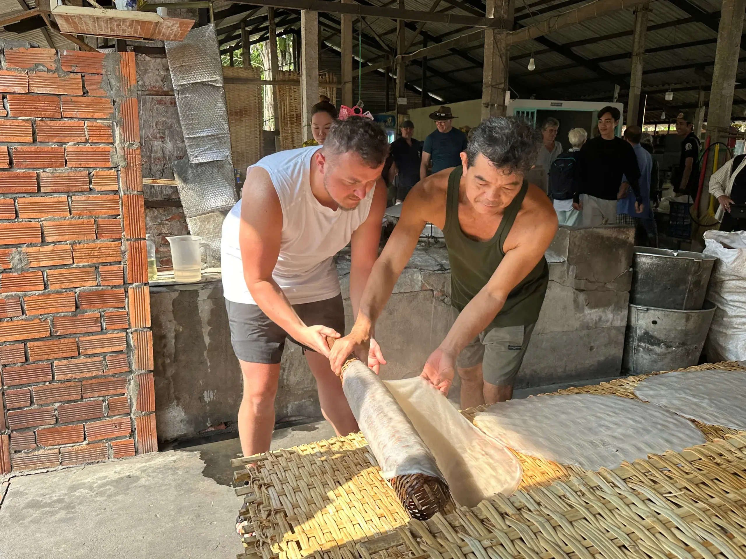 Discover the authentic craft of traditional rice noodle making in the Mekong Delta. Visitors experience hands-on production at a local workshop, learning how fresh rice sheets are carefully steamed, rolled, and dried using time-honored techniques. This cultural activity offers a deeper insight into rural life and local cuisine in southern Vietnam, making it a highlight for travelers exploring the region.