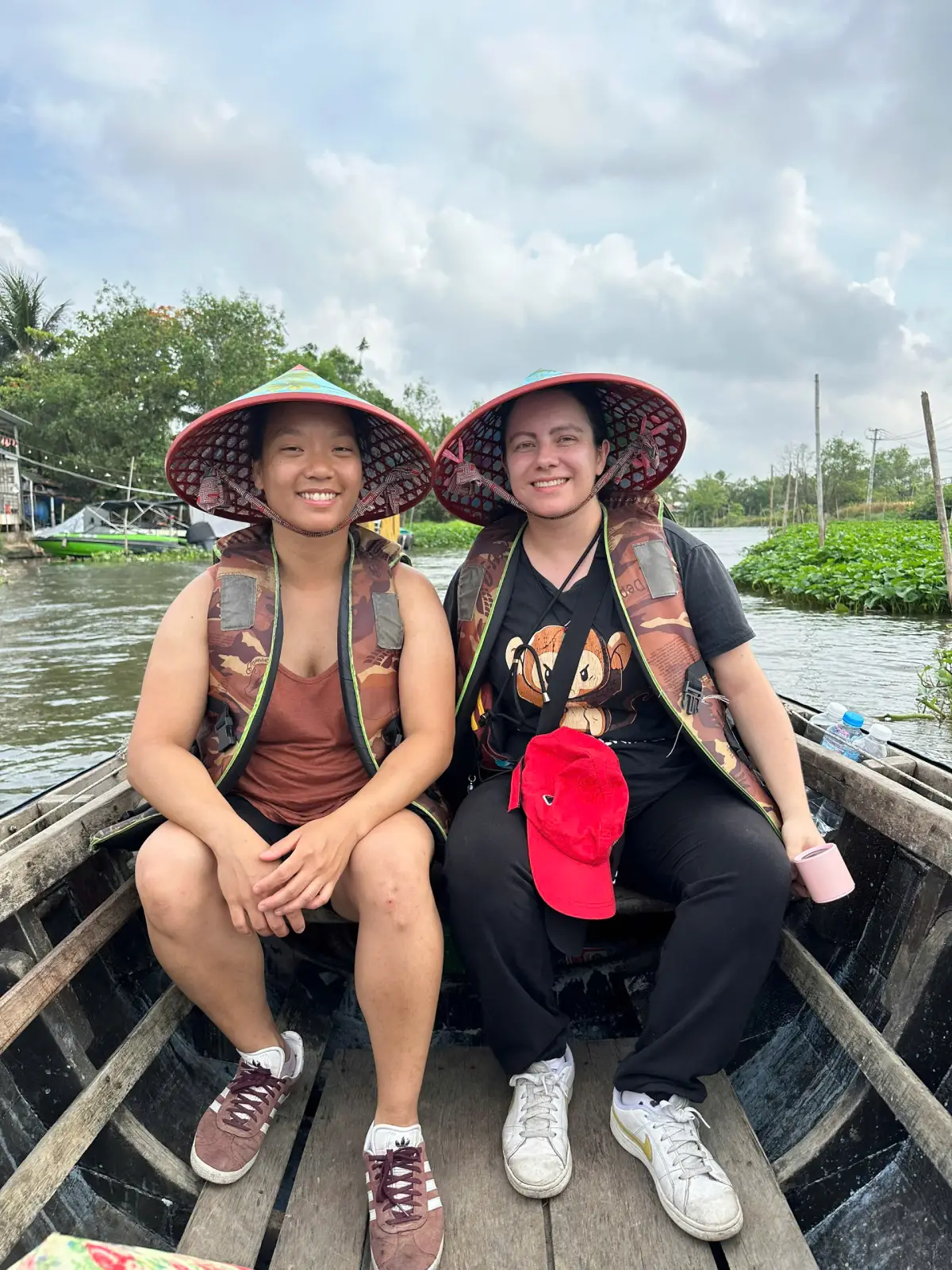 Experience a peaceful boat ride through the small canals of the Mekong Delta, surrounded by lush green coconut trees and floating water plants. Discover the authentic beauty of southern Vietnam and enjoy local life along the hidden waterways.
