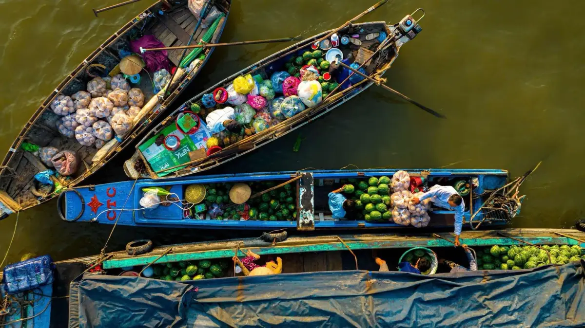 Discover the colorful atmosphere of the Cai Rang Floating Market, one of the most iconic attractions in the Mekong Delta. Witness boats filled with fresh tropical fruits and local produce as traders gather on the river at sunrise.